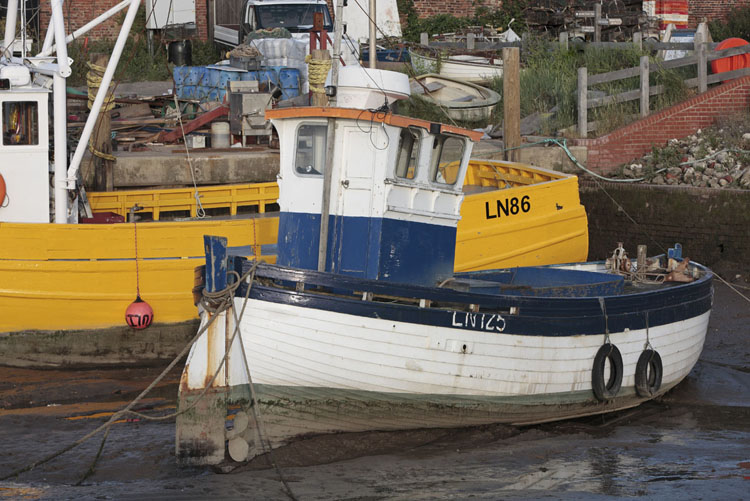 Boats at Brancaster Staithe, low tide, Norfolk