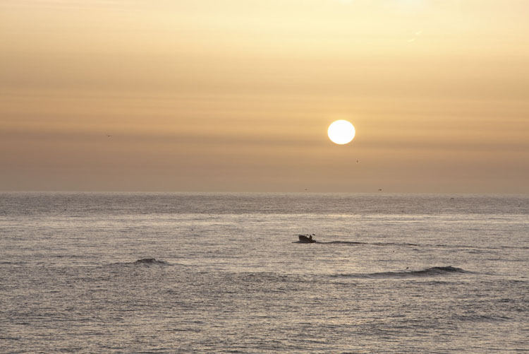 Lonely fishing boat at the sunset in Cromer, Norfolk