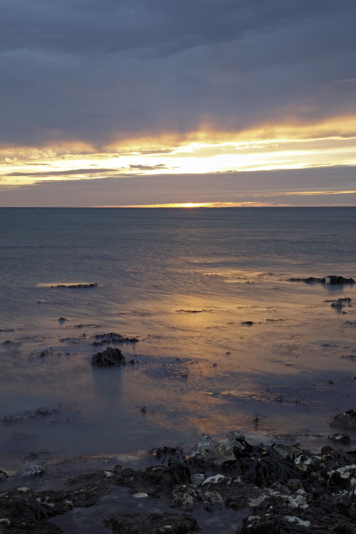 Sunrise glow at West Runton beach near Cromer, Norfolk