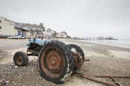 An old tractor used for boat launching on the Sheringham beach, Norfolk